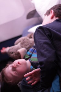 Boys sleeping on airplane Ralph, Oscar Blair