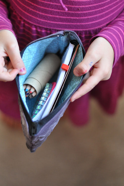  |  Easy Zipper Pouch Tutorial featured by top US lifestyle blog, Design Mom: image a girl holding a zipper pouch