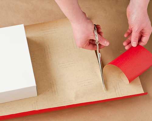 8 Best Christmas Crafts featured by top US lifestyle blog, Design Mom: image of a present being wrapped