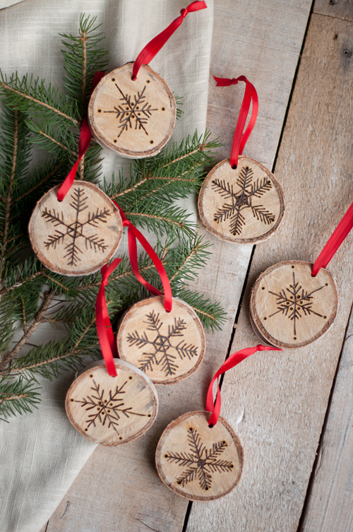 8 Best Christmas Crafts featured by top US lifestyle blog, Design Mom: image of woodburned snowflakes