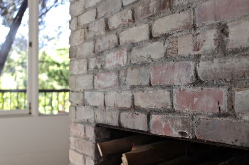 How to Whitewash Bricks - using natural paint that let's the bricks "breathe" | Design Mom - Whitewashed Bricks Tutorial featured on top lifestyle blog, Design Mom