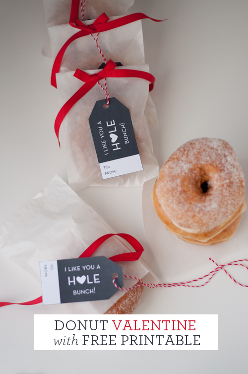 Easy Donut Valentines with Free Printable. Tags read: I like you a "hole" bunch. Donuts in glassine bags with red grosgrain ribbon. Tags attached with red and white baker's twine.