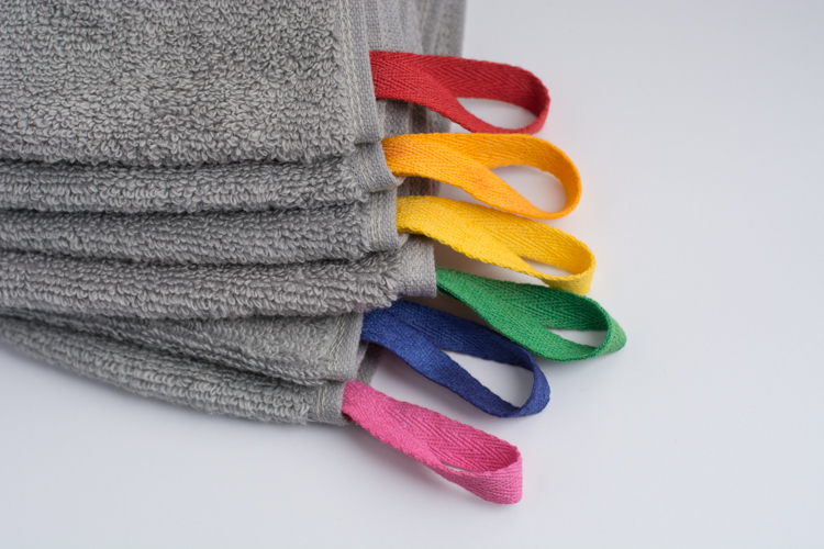 DIY: Color Coded Towels. Assign a color to each family member and say goodbye to towel confusion in shared bathrooms!