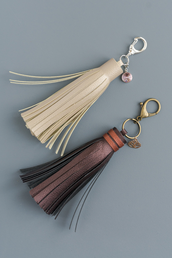 Easy DIY Leather Tassels - Use a Cricut Machine for the cutting! Add charms or bands of color!