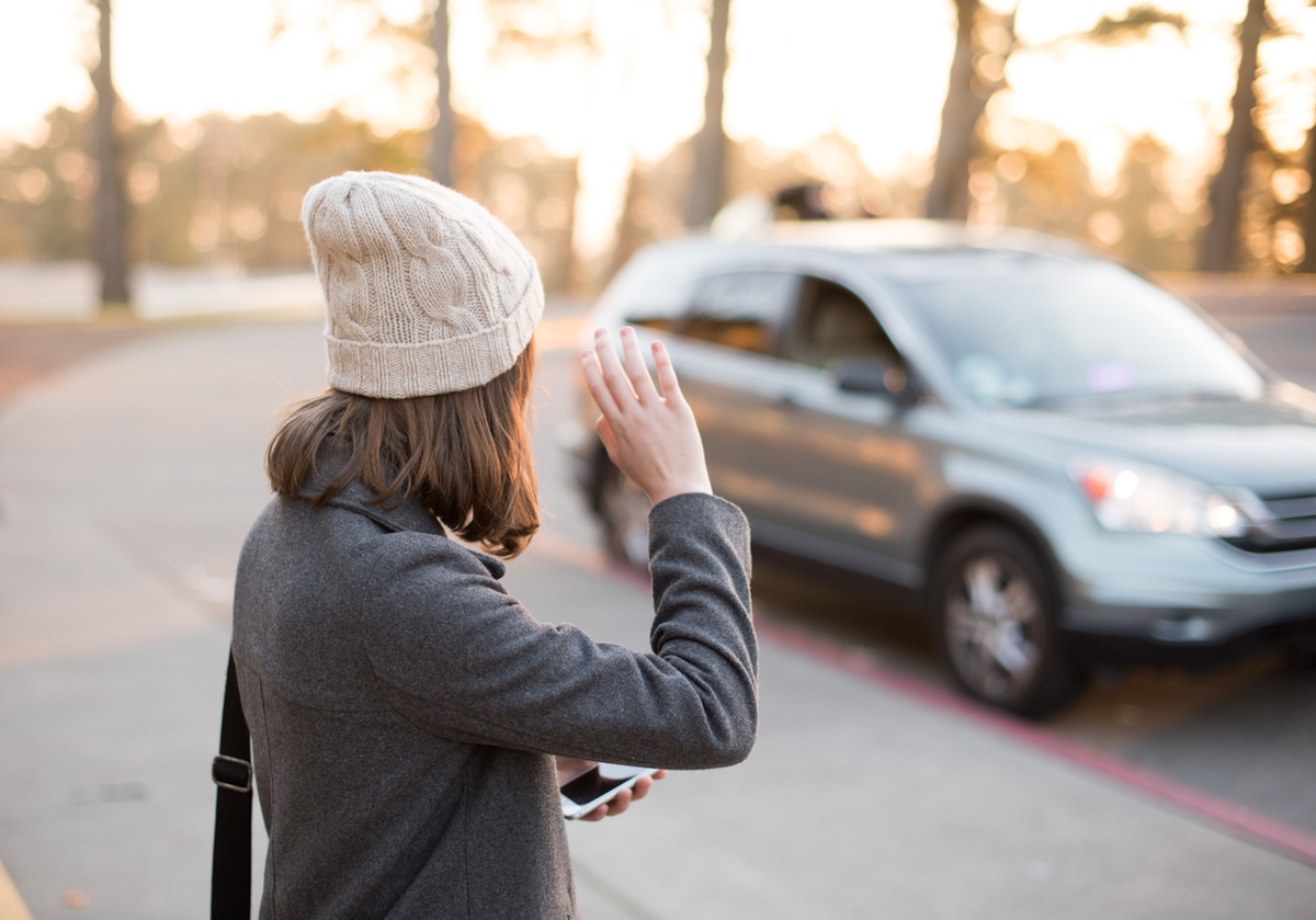 New Family holiday traditions featured by top US lifestyle blog, Design Mom: image of a girl flagging her Uber