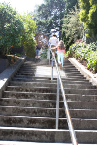 Top lifestyle blogger, Design Mom, shares her thoughts on step-parenting: picture of a family going up some stairs in a public garden
